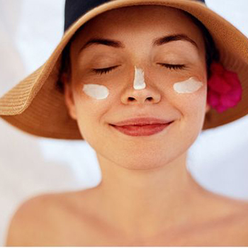 A woman wearing a large sun hat